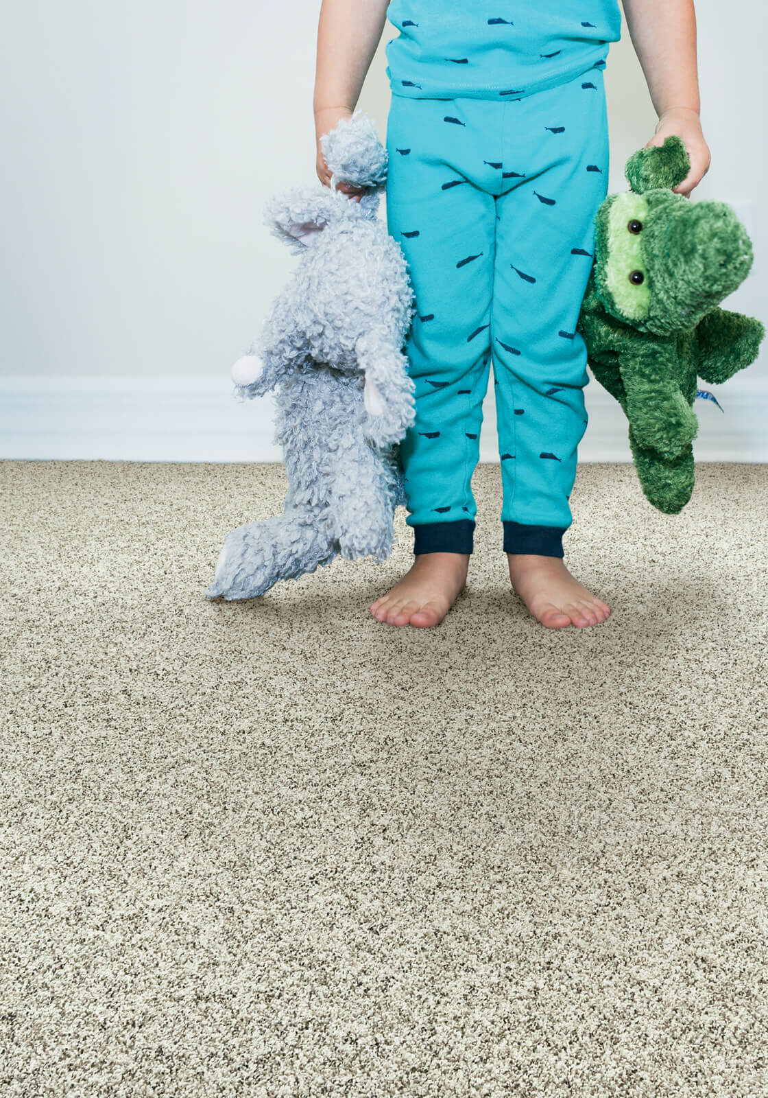 Kid with toys standing on soft carpet | RDC Renovations