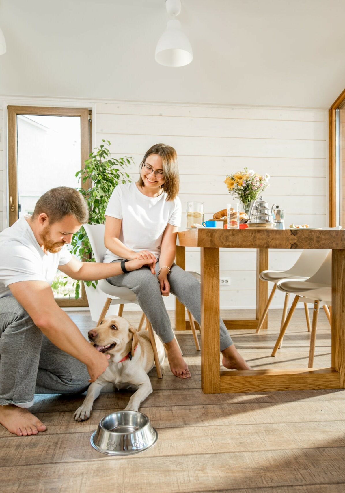 Happy couple with dog at home | RDC Renovations