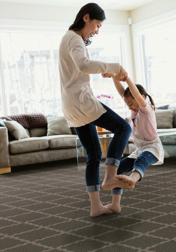 Mom playing with baby on Carpet flooring | RDC Renovations